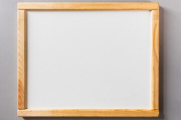 Whiteboard with a light wooden frame. Place for text, notes. White memo board