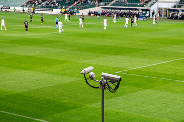 CCTV security cameras on a football stadium for fans monitoring.