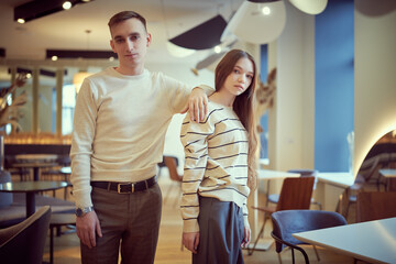 Naklejka premium young couple in cafe