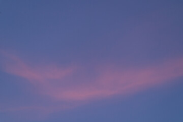 Sunset. Blue sky with red cloud. Background photography.