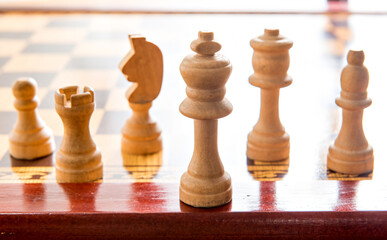 Wooden chess pieces, board game and strategy, chess game
