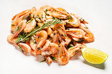 shrimps with lime dressing on the wooden background