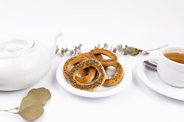white porcelain cup with tea for tomorrow on the table with a saucer
