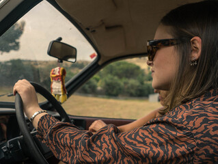Caucasian female driving a car
