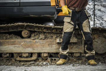 Bulldozer Operator in Front of His Crawler © Tomasz Zajda