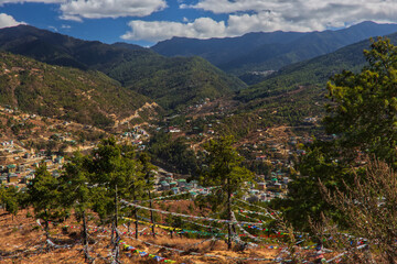  A view of the Paro, Bhutan valley with prayer flags in the foreground