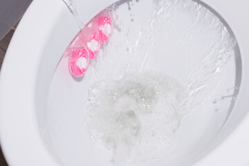 rinse water in a clean toilet. close-up