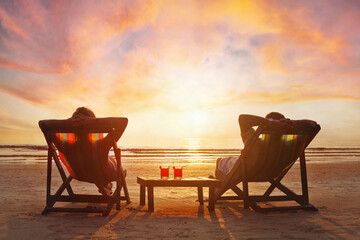 vacation travel, happy retired couple relaxing on sunset beach, romantic getaway