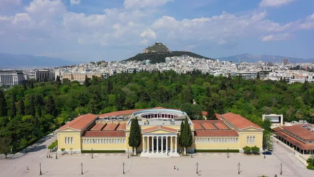 Aerial drone video of iconic public Zappio hall used for events and whole Athens cityscape at the background, Attica, Greece