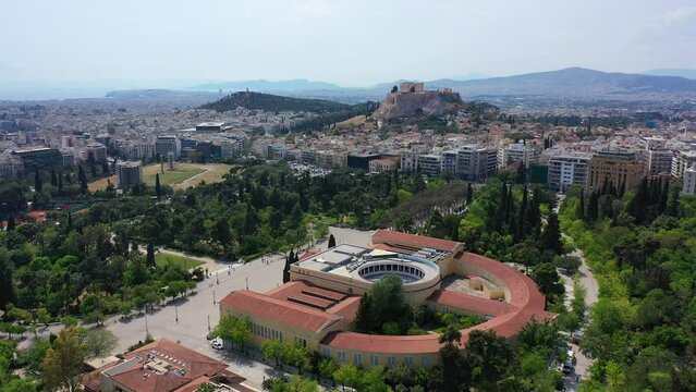 Aerial drone video of iconic public Zappio hall used for events and whole Athens cityscape at the background, Attica, Greece