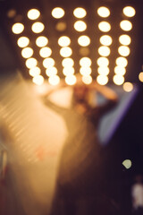bokeh lights in the club with woman silhouette