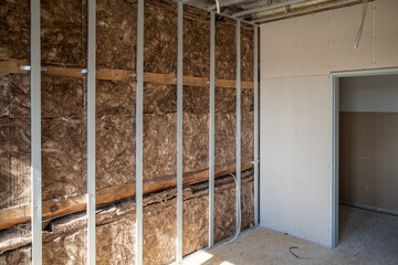 brown Insulation wool was installed behind a drywall