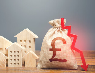 Houses and british pound sterling money bag with down arrow. Reducing maintaining cost, energy...