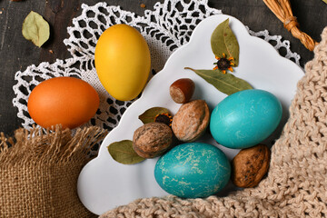 easter holiday still life and decorations, easter eggs on a dark wooden background