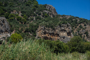 Fototapeta na wymiar Lycian tombs near Dalyan across the Dalyan river in Mugla Province located between the districts of Marmaris and Fethiye on the south-west coast of Turkey