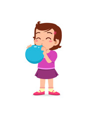 little kid standing and blowing a balloon