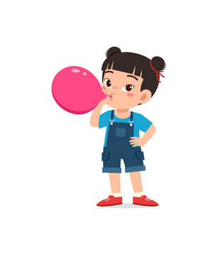 little kid standing and blowing a balloon
