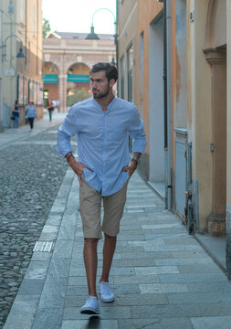 Handsome Italian Dark-haired Boy Walks Downtown In Bermuda