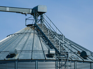Details of modern granary elevator. Silver silos.