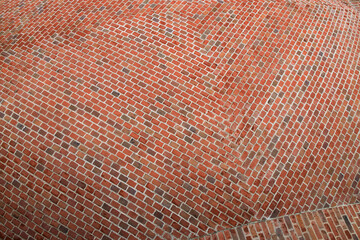 Fragment of the surface of a spherical red brick roof