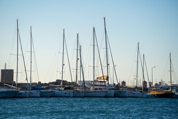 Fototapeta na wymiar Boat masts in row in a sunny day.in Black and white.