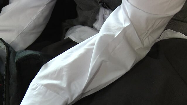 Self harm cutting scars on teenage school girl's legs above the knees.