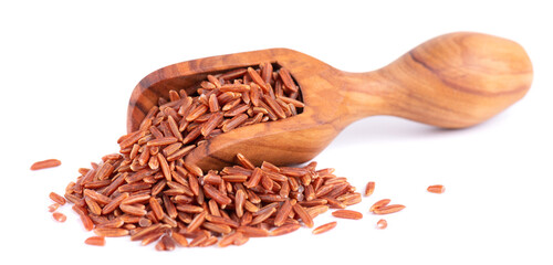 Red rice isolated in olive scoop, on white background. Whole grain raw brown rice.