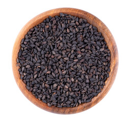 Fototapeta premium Black sesame seeds in wooden bowl, isolated on white background. Organic spice. Top view.