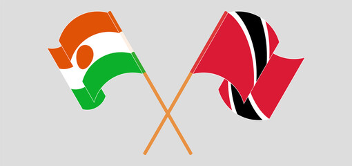 Crossed and waving flags of Niger and Trinidad and Tobago