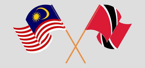 Crossed and waving flags of Trinidad and Tobago and Malaysia