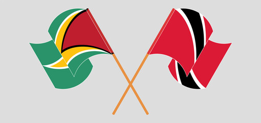 Crossed and waving flags of Guyana and Trinidad and Tobago