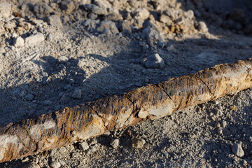 Close-up of old earth, big  cable, signs of corrosion. Earthworks,