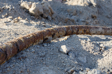 Rusted electrical cable, construction work in the ground.