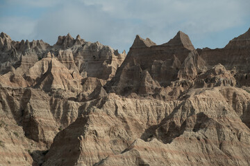 Sunlight Paints the layered hills of Badlands National Park