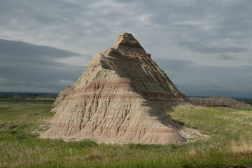 Sunlight Paints the layered hills of Badlands National Park