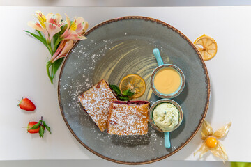 Apple strudel with honey and ice cream and fresh berries