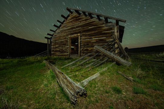 A log cabin and the beautiful mountains of the Wind River Range