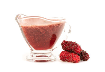 Mulberry fruits and juice isolated on white background.