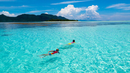 Kids snorkel. Children snorkeling in tropical sea.