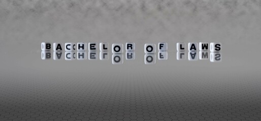 bachelor of laws word or concept represented by black and white letter cubes on a grey horizon background stretching to infinity
