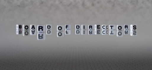 board of directors word or concept represented by black and white letter cubes on a grey horizon background stretching to infinity - obrazy, fototapety, plakaty