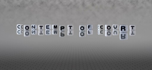 contempt of court word or concept represented by black and white letter cubes on a grey horizon...
