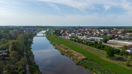 View on city Srem in Wielkopolska region (Greater Poland) with river Warta from above. - obrazy, fototapety, plakaty