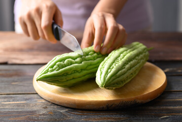 Bitter melon or bitter gourd cutting and cooking