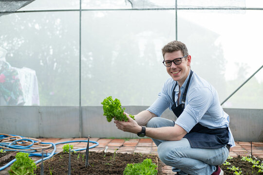 Smart modern agriculture people holding lettuce