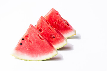 Three watermelon slices on an isolated white background
