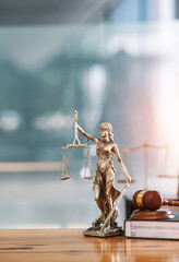 Legal and law concept. Statue of Lady Justice with scales of justice and wooden judge gavel on...