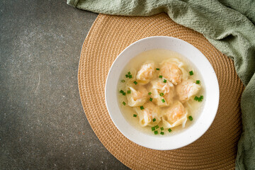 shrimp dumpling soup in white bowl