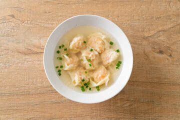 shrimp dumpling soup in white bowl