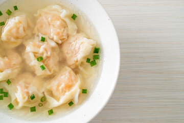 shrimp dumpling soup in white bowl